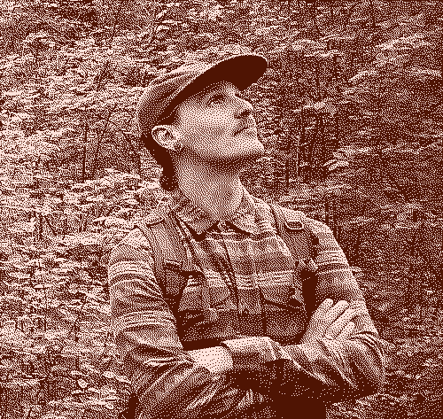 A profile picture of Chris Oram standing in a forest